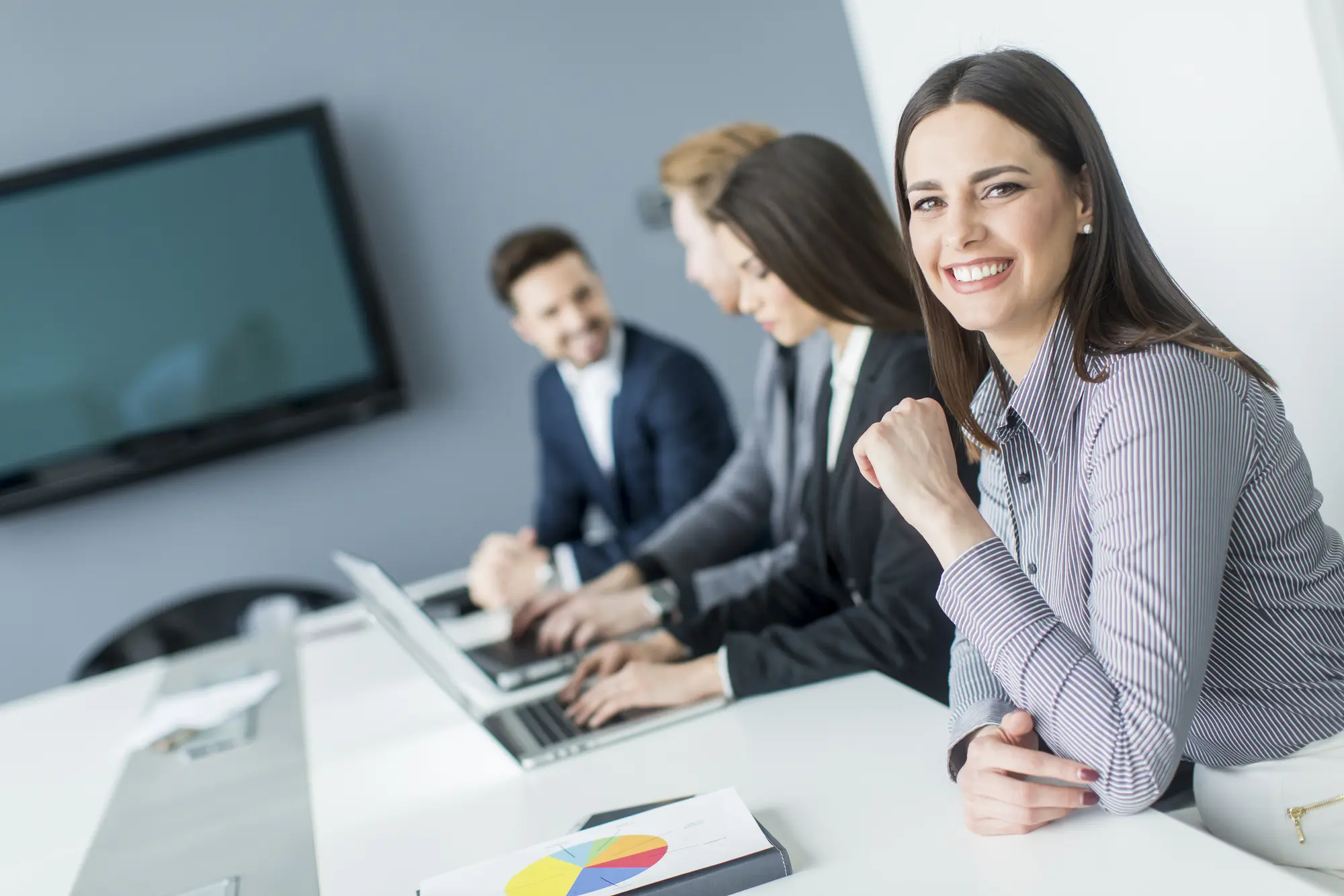 Accounting Services NZ | Young Professional NZ Accountants at Work Young accountants working together in a modern office, providing professional accounting services in New Zealand.